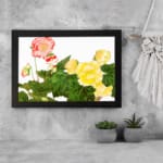 Infidu vintage wall art with detailed floral vintage art design, featuring pink, red, and yellow flowers with green leaves on a white background. displayed on the wall art in a black frame