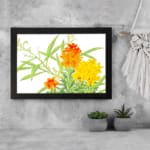 Infidu vintage wall art with orange and yellow flowers, green leaves, and a black frame on a white background for a timeless and elegant look. displayed on the wall art in a black frame