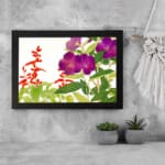 Infidu vintage wall art with deep purple and bright red flowers, green leaves, and a white background, framed in black for a classic and elegant look. displayed on the wall