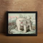 Vintage wall art featuring a polar bear in an icy Arctic landscape with icebergs, explorers, and a soft blue and pink sky. displayed on the wall in a black frame