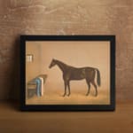 Infidu vintage wall art featuring an elegant horse standing in a cozy stable, with soft brown and beige tones, a small window, and rustic details. displayed on the wall art in a black frame