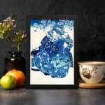 Infidu vintage wall art featuring a graceful figure in a patterned kimono with floral details, set against a soft cherry blossom background in a classic blue and white color scheme. displayed on the wall art in a black frame