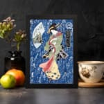 Japanese woman in colorful kimono with calligraphy background, vintage art style displayed on the wall in a black frame