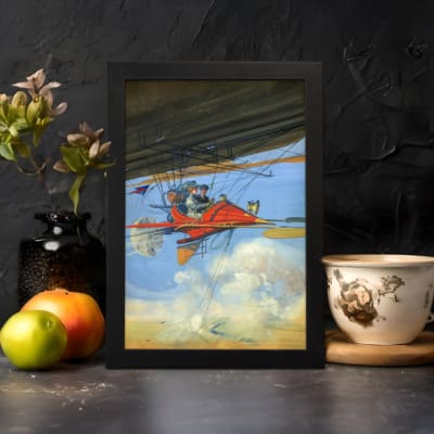 Infidu vintage wall art featuring a red airplane soaring through a bright blue sky with white clouds, evoking a sense of adventure and exploration. displayed on the wall art in a black frame