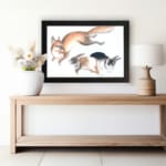 Infidu vintage wall art featuring a playful illustration of a jumping fox and two running rabbits in soft, natural colors against a clean white background. displayed on the wall art in a black frame