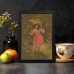 Infidu vintage wall art depicting a young girl in a pink dress holding a large green leaf over her head, set in a nostalgic outdoor scene with warm earthy tones. displayed on the wall art in a black frame
