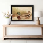 Infidu vintage wall art depicting two ducks swimming in a peaceful pond, surrounded by soft grass and gentle water waves, in calming green, brown, and beige tones. displayed on the wall art in a black frame