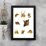 Vintage wall art showing detailed illustrations of deer, wild boar, and forest animals on a white background in natural earthy tones. displayed on the wall in a black frame