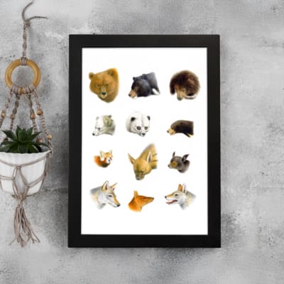 Vintage animal wall art with colorful faces in brown, white, black, and yellow, framed in black with a white background for a modern look. displayed on the wall