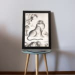 Vintage Asian tiger painting in black and white, featuring bold stripes, expressive eyes, and a natural background with trees and mountains. displayed on the table
