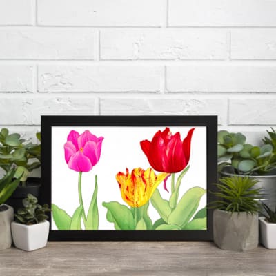 Infidu Vintage Floral Wall Art with pink, red, and yellow tulips, green leaves, and a black frame on a white background. displayed on the wall