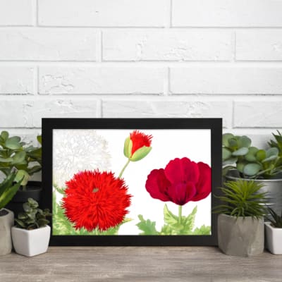 Infidu Vintage Floral Wall Art with red flowers, green leaves, and a black frame on a white background. displayed on the wall