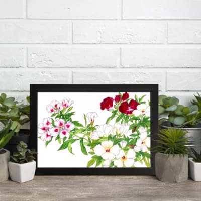 Infidu Vintage Floral Wall Art with white, pink, and red flowers, green leaves, and a black frame on a white background. displayed on the wall