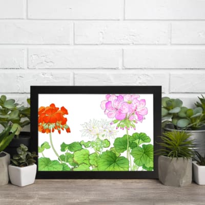 Infidu Vintage Floral Wall Art with orange, pink, and white flowers, green leaves, and a black frame on a white background. displayed on the wall