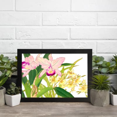 Vintage floral wall art with pink and yellow flowers, green leaves, and a black frame on a white background. displayed on the wall