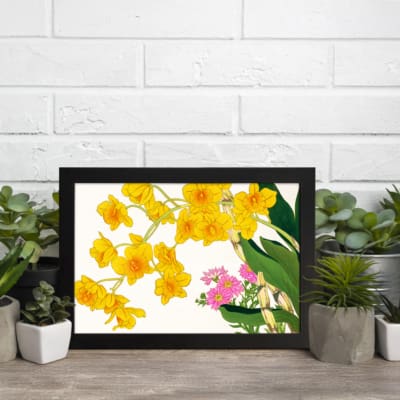 Infidu Vintage Floral Wall Art with yellow and pink flowers, green leaves, and a black frame on a white background. displayed on the wall
