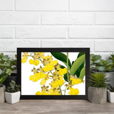 Vintage floral wall art with yellow flowers and green leaves in a black frame. displayed on the wall