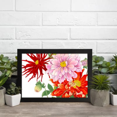 Vintage floral wall art with red, pink, and orange flowers, green leaves, and a black frame on a white background. displayed on the wall