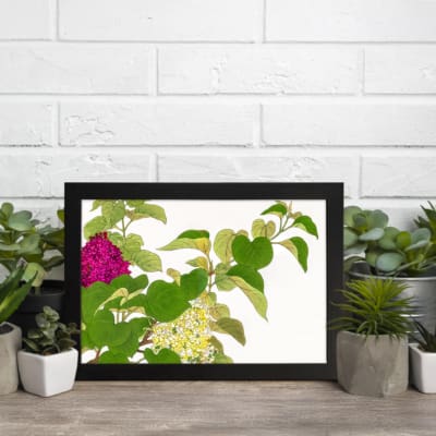 Infidu Vintage Floral Wall Art with pink and yellow flowers, green leaves, and a white background, framed in black for a stylish look. displayed on the wall