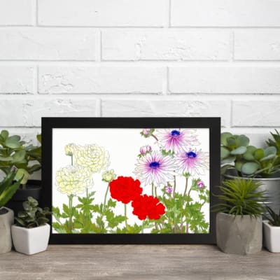 Vintage floral wall art with yellow, red, and purple flowers and green leaves on a white background. displayed on the wall