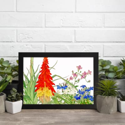 Infidu Vintage Botanical Wall Art with red, yellow, pink, and blue flowers, green leaves, and white background, creating a fresh and elegant look. displayed on the wall in a black frame