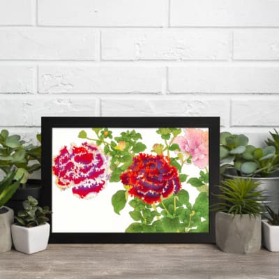 Infidu Vintage Floral Wall Art with red, purple, and pink flowers, green leaves, and a black frame on a white background. displayed on the wall