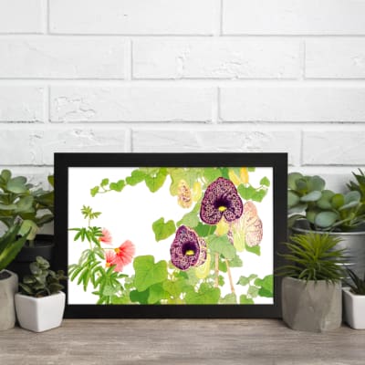 Infidu Vintage Floral Wall Art with deep purple and soft pink flowers, green leaves, and a black frame on a white background. displayed on the wall