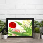 Infidu vintage wall art with red, pink, and yellow flowers, green leaves, and a black frame on a white background for a timeless botanical look. displayed on the wall art in a black frame