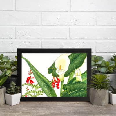 Infidu vintage wall art with white calla lilies, red flowers, and green leaves on a white background, framed in black for a classic and stylish look. displayed on the wall