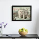 Vintage wall art featuring a polar bear in an icy Arctic landscape with icebergs, explorers, and a soft blue and pink sky. displayed on the wall in a black frame