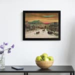 Infidu vintage wall art of a winter scene with horse-drawn sleighs passing through a snowy town, featuring warm sky tones and a peaceful landscape. displayed on the wall art in a black frame