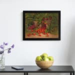 Rustic vintage wall art featuring strawberries spilling from wooden baskets with green leaves and a garden background. displayed on the wall in a black frame