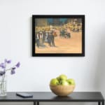 Infidu vintage wall art depicting a bustling city street scene with early 20th-century charm, featuring elegantly dressed people, vintage cars, and glowing city lights against tall buildings. displayed on the wall art in a black frame