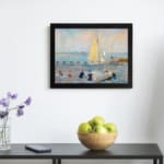 Infidu vintage wall art featuring a peaceful seaside scene with a sailboat on calm waters, people on the beach, and soft pastel colors in the sky. displayed on the wall art in a black frame