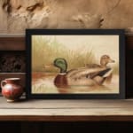 Infidu vintage wall art depicting two ducks swimming in a peaceful pond, surrounded by soft grass and gentle water waves, in calming green, brown, and beige tones. displayed on the wall art in a black frame