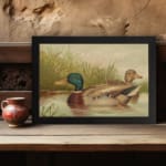 Vintage wall art of a peaceful duck pond scene with two ducks swimming, tall grass in the background, and soft earthy tones for a classic look. displayed on the wall