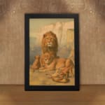 Vintage wall art of a majestic lion family in a natural setting with warm earthy tones, including a lion, lioness, and cubs in a savannah backdrop. displayed on the wall in a black frame