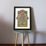 Vintage Celtic wall art with intricate medieval patterns in blue, green, gold, and red, featuring swirling shapes and mythical elements. displayed on the table in a black frame