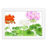 Infidu Vintage Floral Wall Art with orange, pink, and white flowers, green leaves, and a white frame on a white background. hung on the wall
