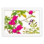 Infidu vintage wall art with bright pink, purple, and white flowers, green leaves, and a black frame on a white background for a classic look. hung on the wall on a white background