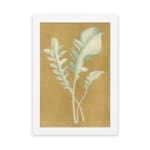 Vintage wall art of pale botanical fronds on an ochre background with a white frame hung on the wall