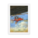 Infidu vintage wall art featuring a red airplane soaring through a bright blue sky with white clouds, evoking a sense of adventure and exploration. hung on the wall on a white background