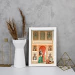 Vintage wall art with a Middle Eastern scene featuring a woman in a flowing outfit, ornate arches, and detailed architecture in warm and vibrant tones. displayed on the wall