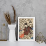 Vintage Japanese ukiyo-e wall art of a scholar writing on a scroll, with intricate calligraphy in the background. displayed on the wall in a white frame