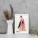 Vintage Japanese wall art of a woman in a floral kimono with intricate details, inspired by traditional woodblock prints. displayed on the wall in a white frame