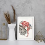 Vintage horror wall art of a red phantom with spiky hair over a black coffin, featuring a traditional Asian style with bold red, black, and white tones. displayed on the wall