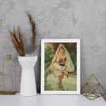 Vintage wall art of a woman sitting by a peaceful pool, surrounded by tropical plants, wearing traditional attire with a headscarf and jewelry. displayed on the wall