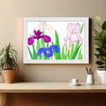 Vintage floral wall art with purple, blue, and pink flowers, green leaves, and a white frame on a white background. displayed on the wall