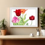 Vintage floral wall art with red, pink, and orange tulips, green leaves, and a white frame on a white background. displayed on the wall