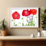 Vintage floral wall art with red and purple-white poppies, green leaves, and a black frame on a white background. displayed on the wall